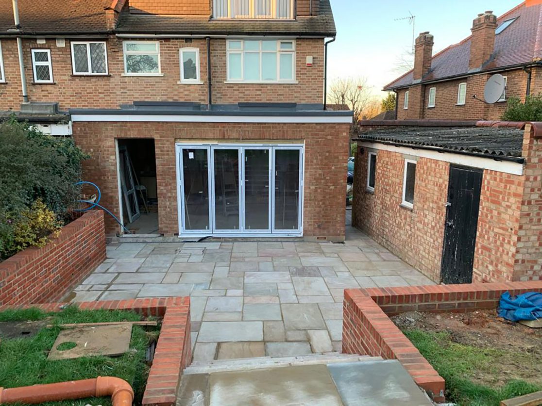 Indian Sandstone patio and brick wall Southgate, North London