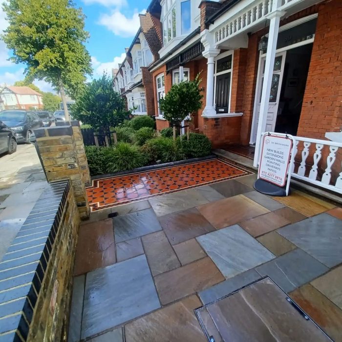 Indian Sandstone patio, brick wall and Victorian tile pathway Palmers Green, North London